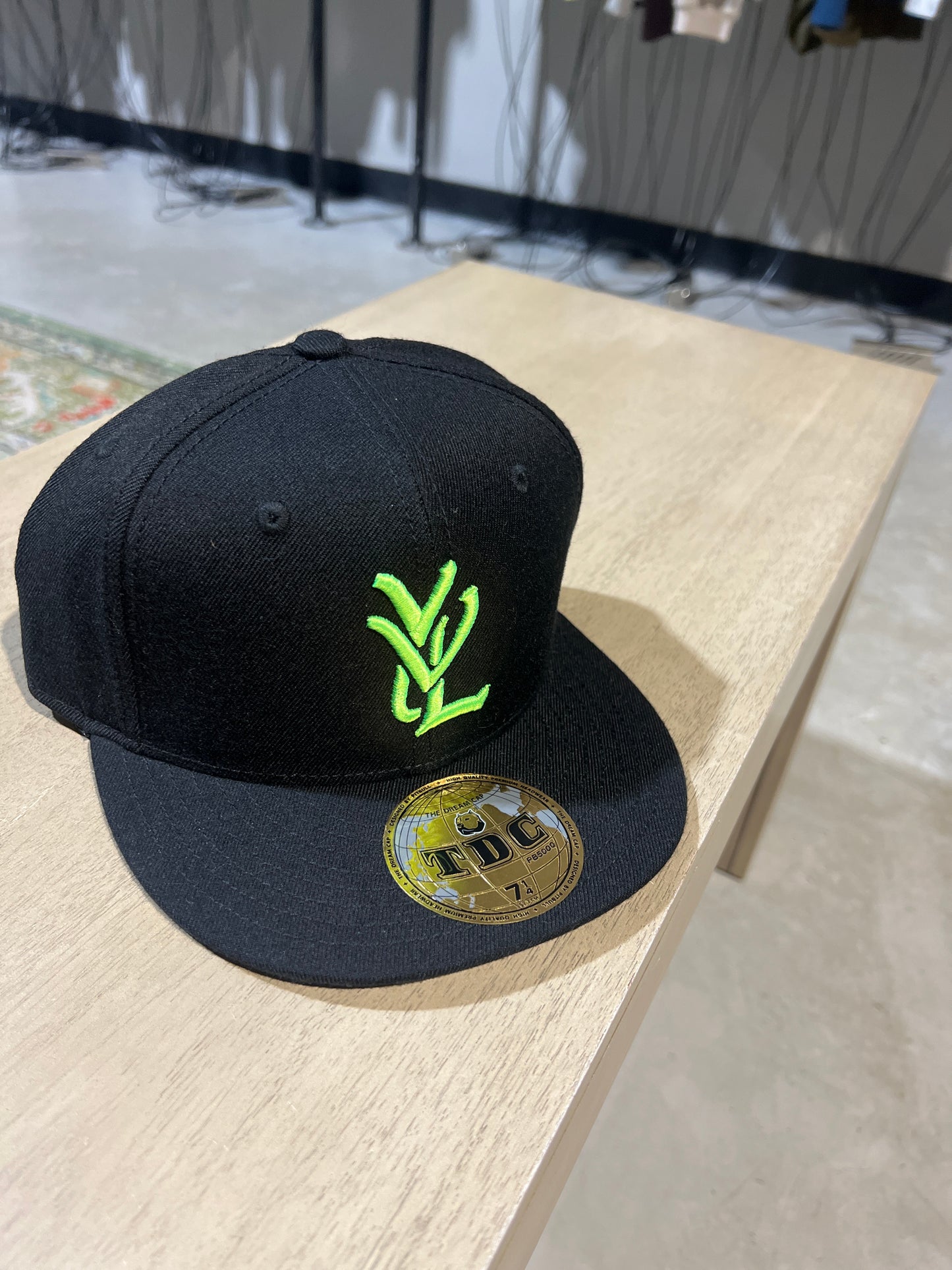 Yvl Black on Green Hat