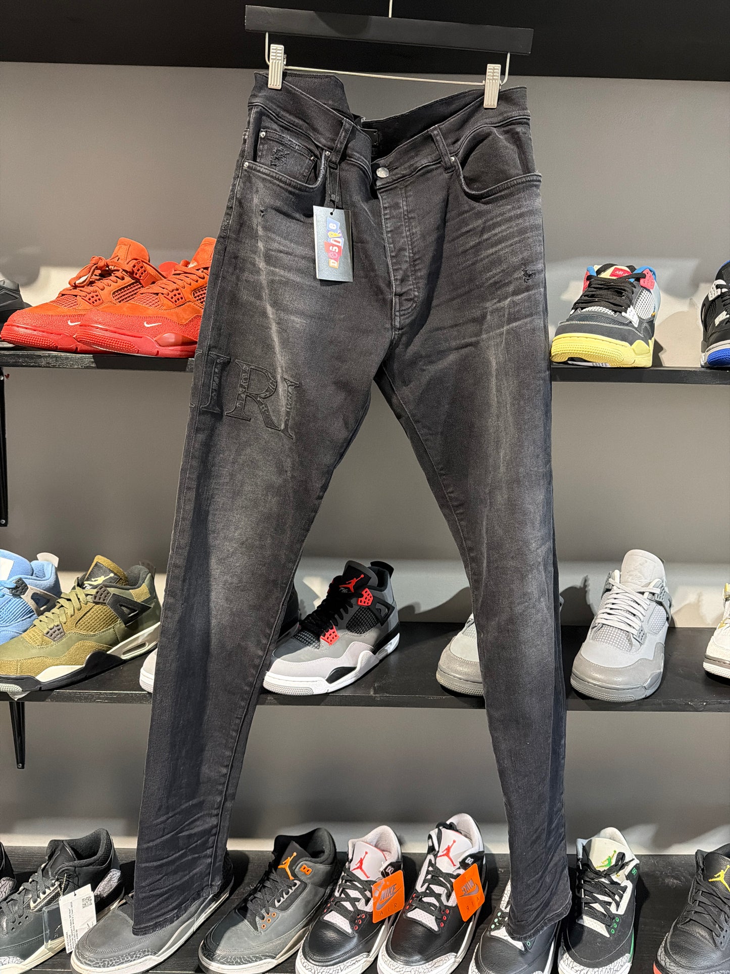 Amiri skinny denim spellout black on black