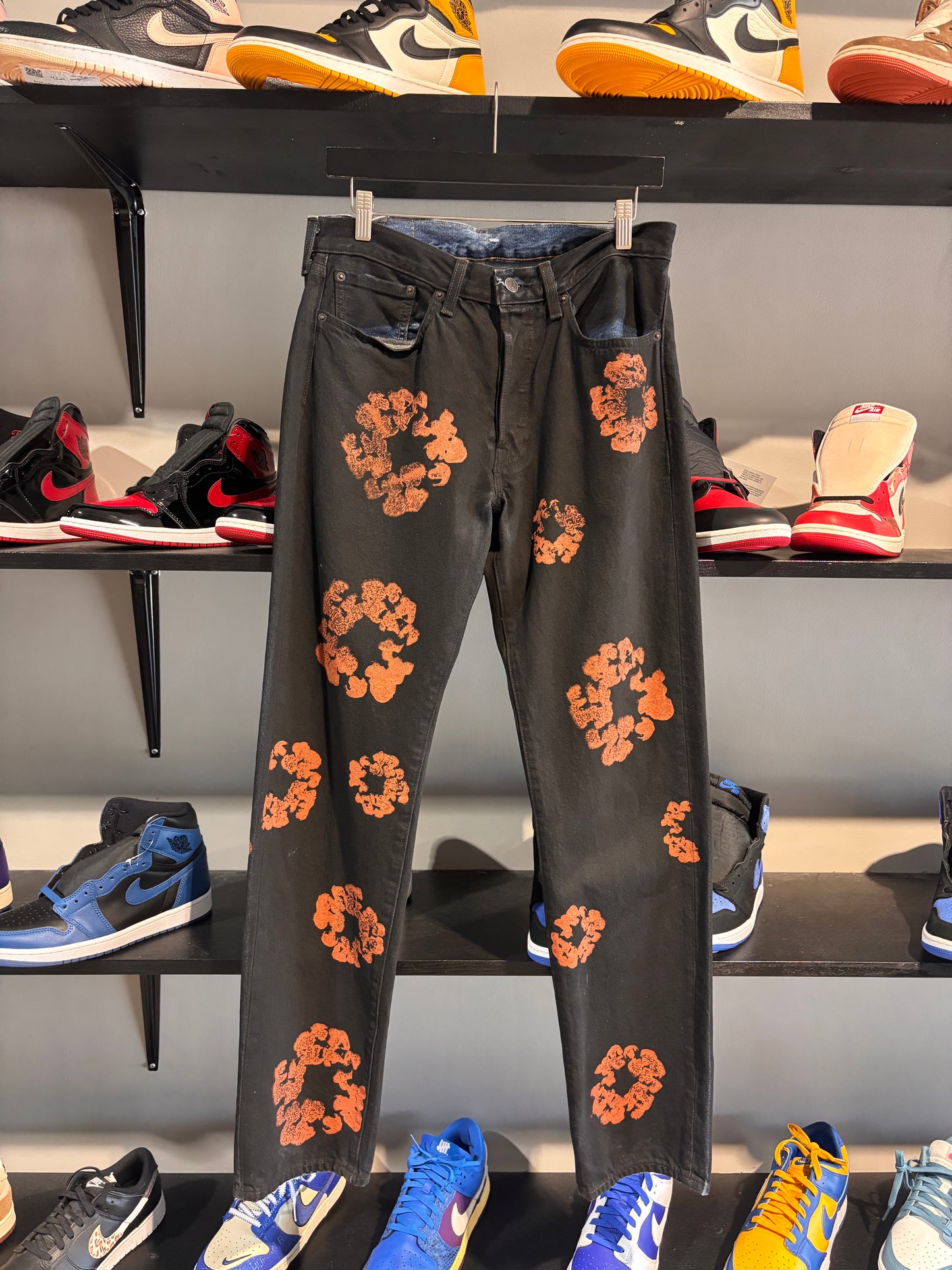 orange/black denim tears jeans