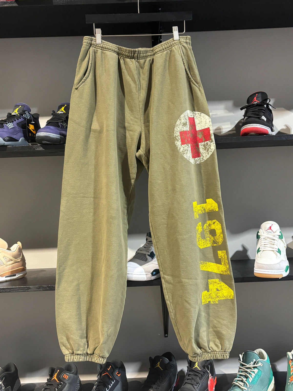 74 Is War Green Aid Sweats