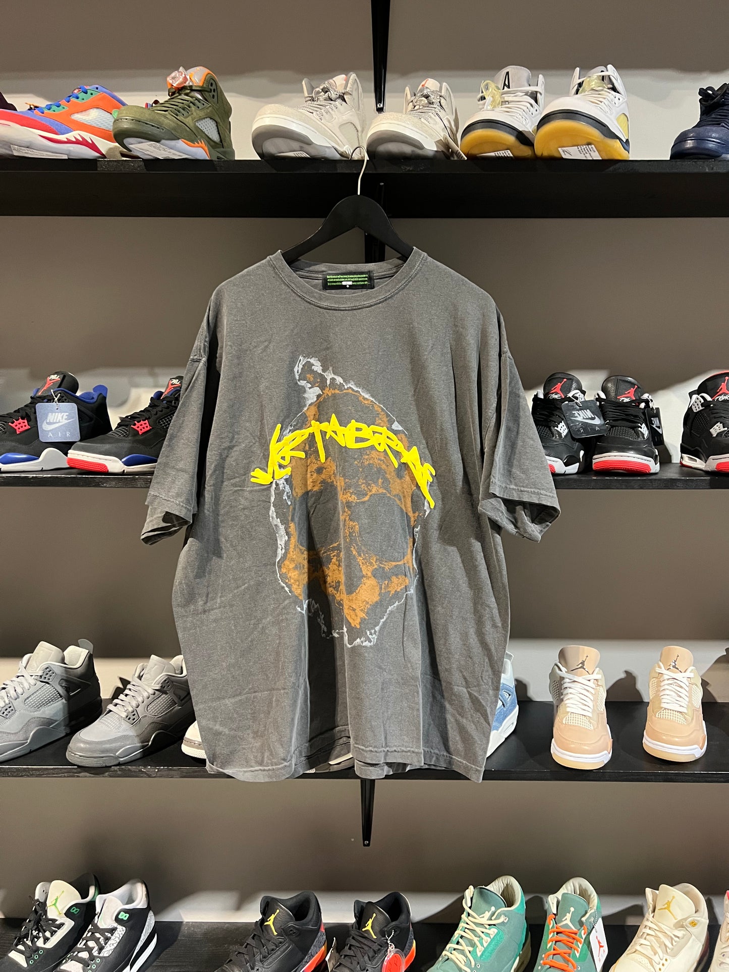 Vertabrae skull yellow spell out tee