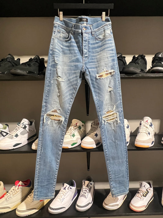 AMIRI MX1 LIGHT WASH W LIGHT BROWN PATCHES