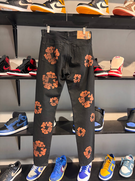 orange/black denim tears jeans